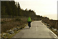Cyclist on the Loch Buidhe Road, Sutherland in IV24 3AT