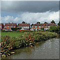 Park, canal and housing in Nuneaton, Warwickshire in CV10 8EN