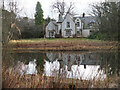 Pond and house in Philiphaugh Estate in TD7 5EZ