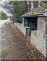 Stone bus shelter, Llanhamlach, Powys in LD3 7YB