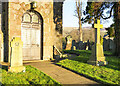 Gravestones and war memorials at St. Peter's Church in CA8 9NE
