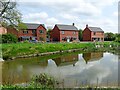 New houses and balancing pond in DE6 3BQ