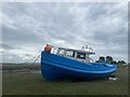 Boat on the Penclawdd saltmarsh in SA4 3JW
