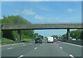M6 passing under footbridge north of Corley Moor in CV7 8AQ