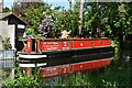 Narrowboat and boathouse, Basingstoke Canal in GU21 5TL