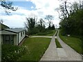 Track through caravan park in Dunscombe in EX10 0PH