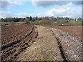 Footpath across a ploughed field near Castleton in CF3 2UP
