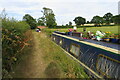 Floral narrowboat by the Grand Union towpath in NN6 6ZF