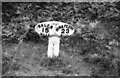 Old milepost in PA69 6ET