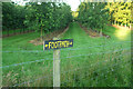 Footpath sign by orchard in WR14 1EN