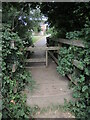 A footbridge between the houses and the fields in BA14 0EH