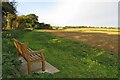 Memorial bench with a view across the farm in SG12 0PG
