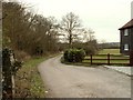 A bridleway and road to Peakes Farm in CM16 7PS