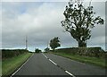 Minor road junction on the top of the rise on A697 in TD10 6UL
