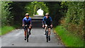 Cyclists heading W by Angus Wood, Stonelaws in EH40 3DX