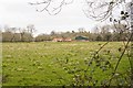 Looking across fields to Whitehouse Farm from footpath in SP5 2ET