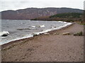 Waves crashing on the beach at Dores in IV2 6TT