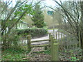 Road and footpath by Newyears Wood in TN14 7PQ