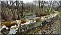 View of Quarry Beck over south parapet of New Mills Bridge in CA8 1EY