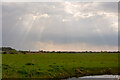 Sunlight breaks through the clouds, Cliffe Marshes in Cliffe and Cliffe Woods