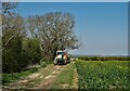 Farm vehicle passing an old chalk pit in Donington on Bain