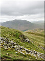 Low crag and broken wall on east side of Birks in Patterdale