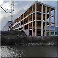 A warehouse rises by the Coventry Canal in CV10 7JU