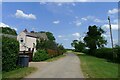 Walks Road passing Grange Farm Cottage in NG34 8RU