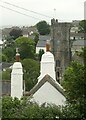 Chimneys and church tower, Plymstock in PL9 9GB