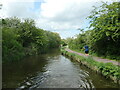 Runner approaching narrows, Shropshire Union canal in CH65 4LT