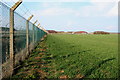 Perimeter fence around Alconbury airfield in Huntingdonshire District