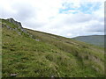 Outcrop of rock on the lower slopes of Gyrn Wigau in Llanllechid Community