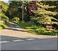 Wooden bench on a corner in Llanfihangel Talyllyn, Powys in LD3 7TG