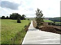 Concrete road towards Warren Lodge Farm in Dingley