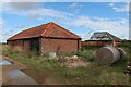 Old barns by Common Lane in NR24 2PH