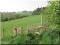 Stile and Footpath Sign through Farmland in NE48 3NX