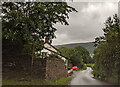 Footpath sign and houses at Lower Henllan in NP7 7NH