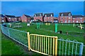 Housing estate and play area in NN11 8PH