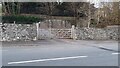View across Bigsteer Road of gateway in stone wall in LA9 5FR