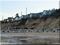 Houses on edge of eroding cliff - Hemsby in NR29 3NY