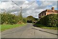 Lane passing High House Farm in TN30 7HY