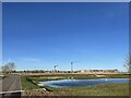 Lake with Waterbeach new town building site in distance in CB25 9RY