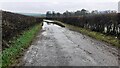 Flooded road south of East Mill Farm in CA7 3BL