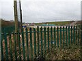Possible construction site over a fence, viewed from Blue Lagoon Park in Bletchley, Milton Keynes in MK3 5FR