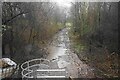 Wet and muddy footpath off Wigan Road in BL5 2DA
