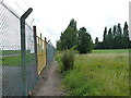 Southeast along the airport boundary fence in B37 7EE