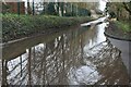 Flooded track at entrance to golf course in BH21 4BD