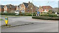 Roundabout and houses north of Zionshill Copse in SO53 4LU