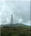 Pylon dominating the moorland near Caerau farm in LL54 6TA