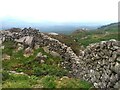 Boulders in the wall of Pen-y-gaer fort in LL55 4YF
